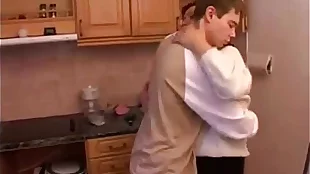 Stepmom and stepson have a sex on the kitchen