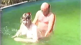 Older inexpert couple in pool